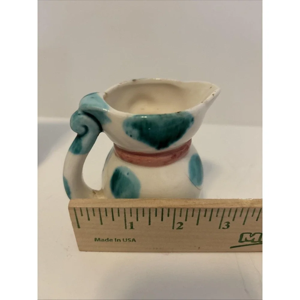 Vintage 1950s ceramic cat pitchers, creamers or part of measuring cup sets.